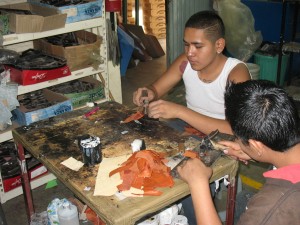 Men doing leatherwork